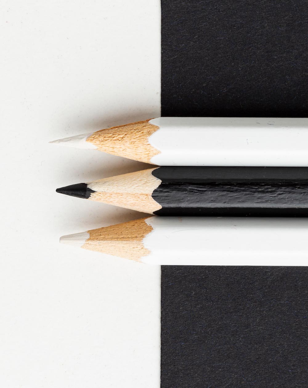 [background image] image of art supplies on a desk (for a graphic design studio)