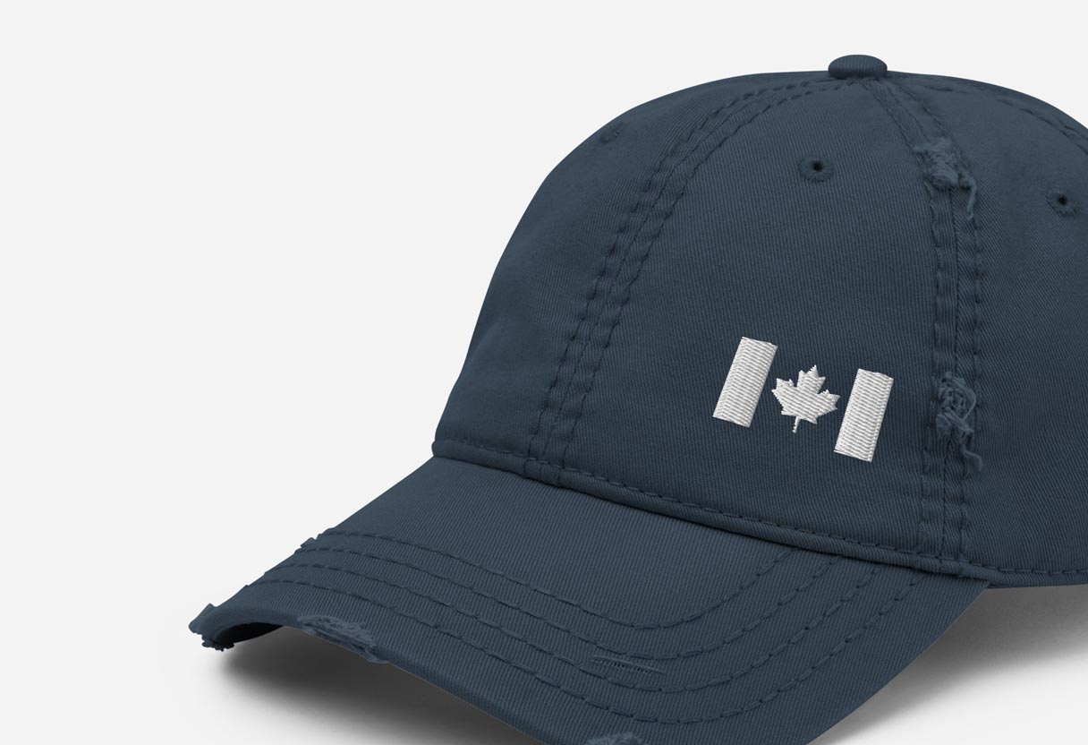 Navy distressed baseball cap featuring an embroidered Canada flag in white